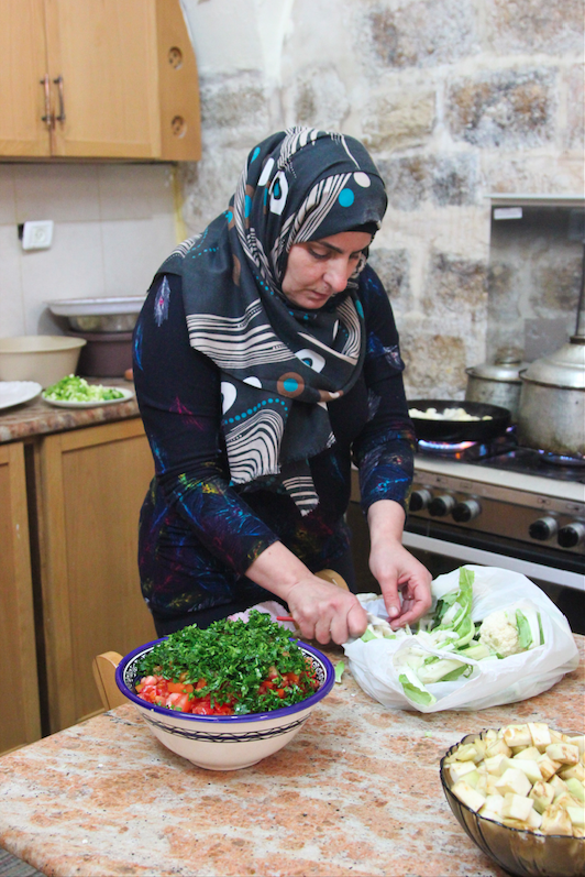 A female employee preparing ingredients. (Photo: Megan Hanna)